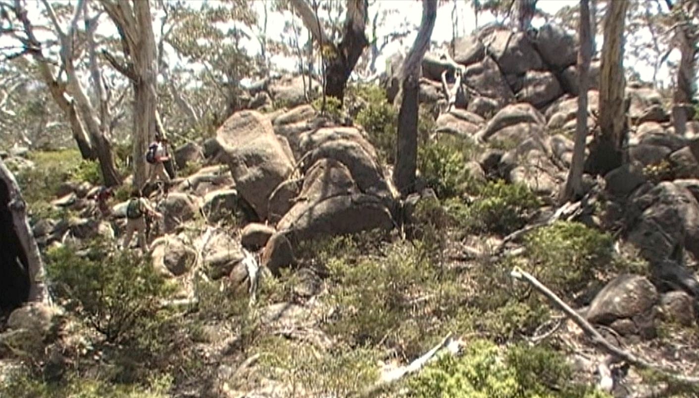 Granite tors and white ash on Mount Tumanmang